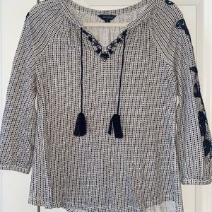 Black and white embroidered blouse.